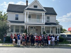 A group outside of Bruce Springsteen's third childhood home in Freehold, New Jersey.